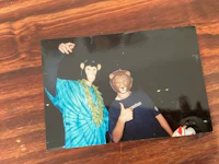 a photo of a man with a monkey mask on a table